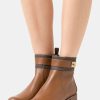 New Michael Michael Kors Padma Strap Flat Bootie Classic Ankle Boots Brown/Luggage